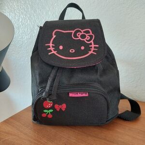 Hello Kitty backpack featuring a pink embroidered design and cherry accents